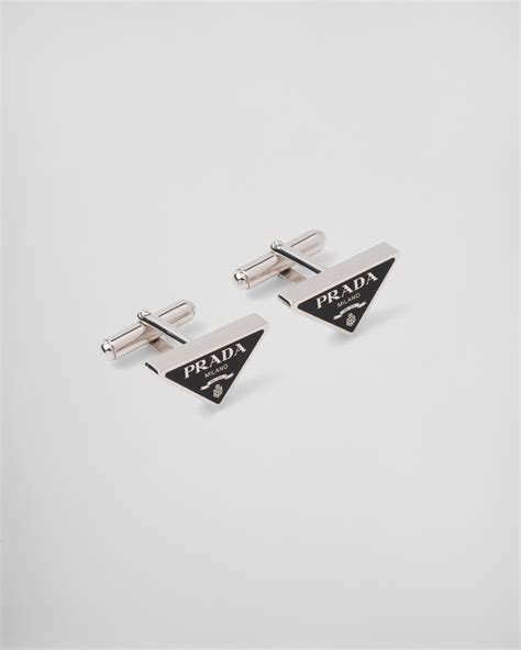 silver prada cufflinks.